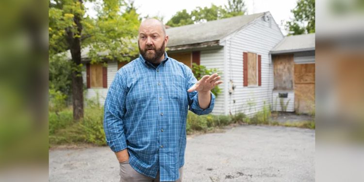 Bruce Spinney III is pictured in September 2019, in front of the property on Worcester Street in Grafton where a business he was seeking to open a marijuana retail store