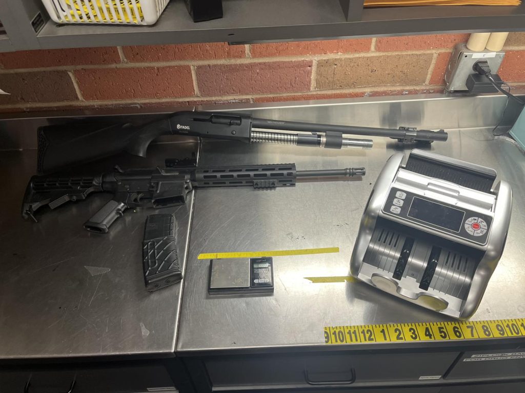 Firearms, a scale, and an electric currency counter. Courtesy: FCPD